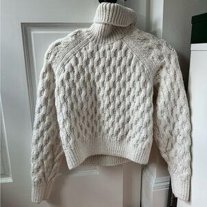 White chunky cable knit turtleneck